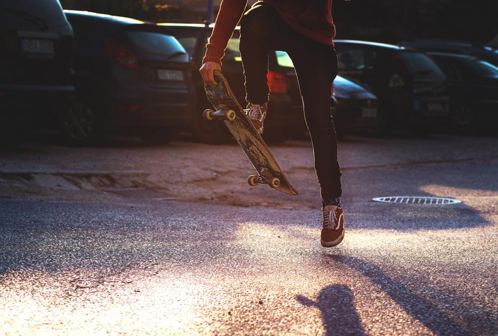 Free Image of A person jumping with a skateboard 