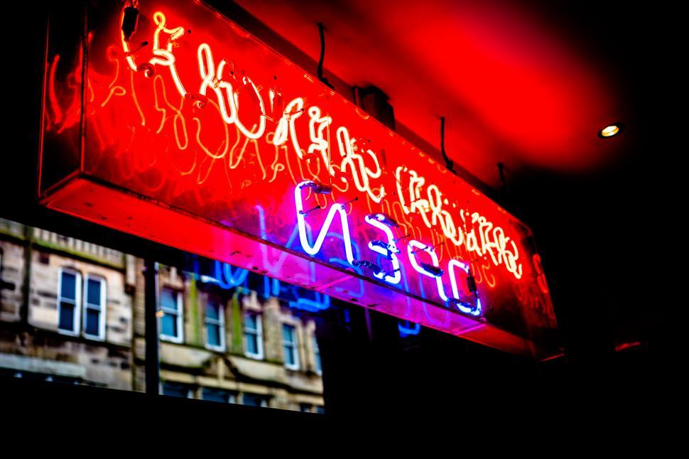 Free Image of A red and blue neon sign 