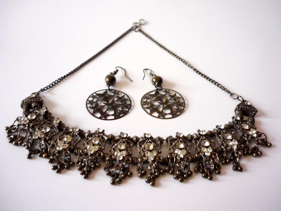 Free Image of Elegant Necklace and Earring Set on White Background 