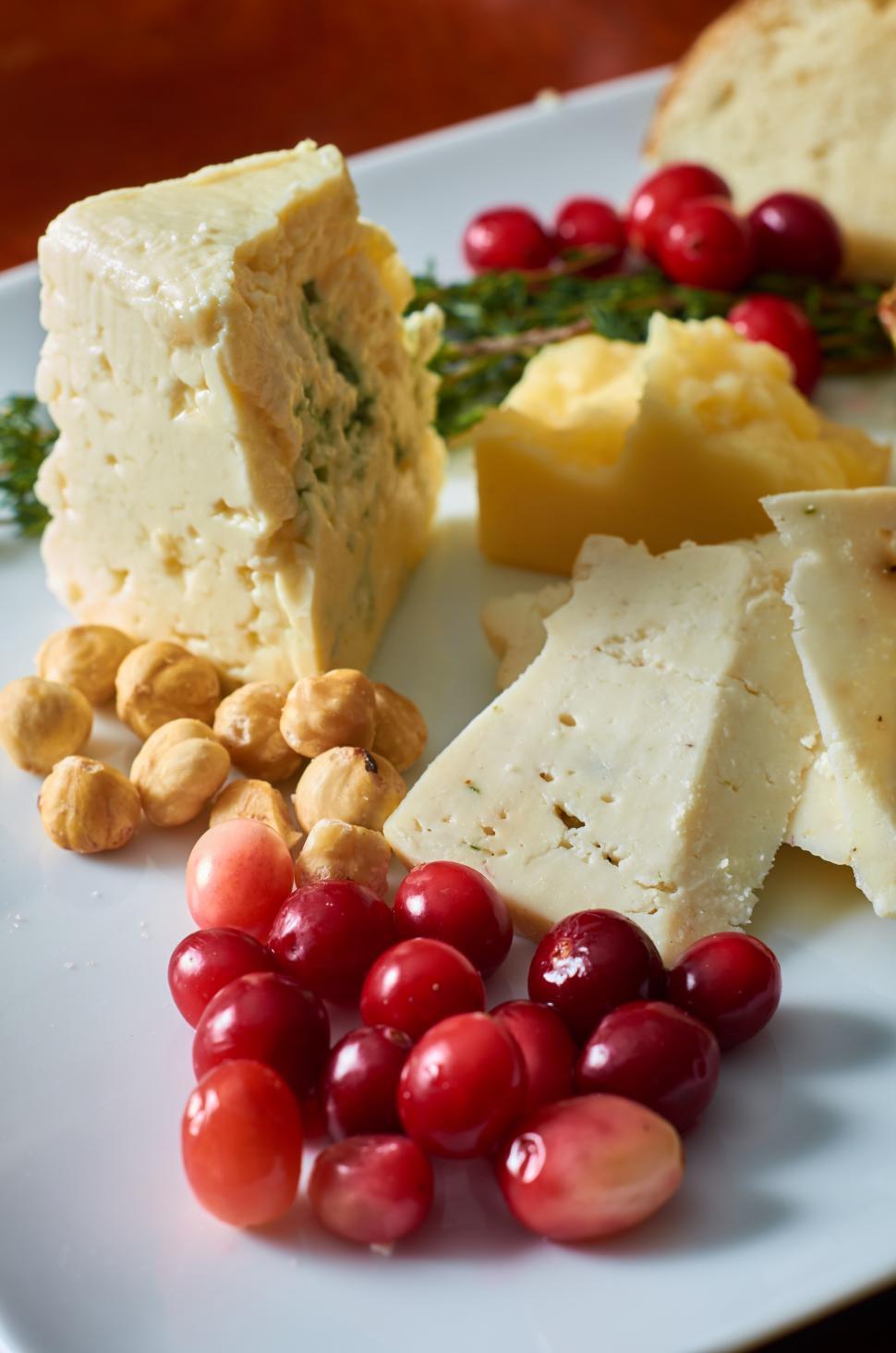 Free Image of A plate of food with cheese and nuts 