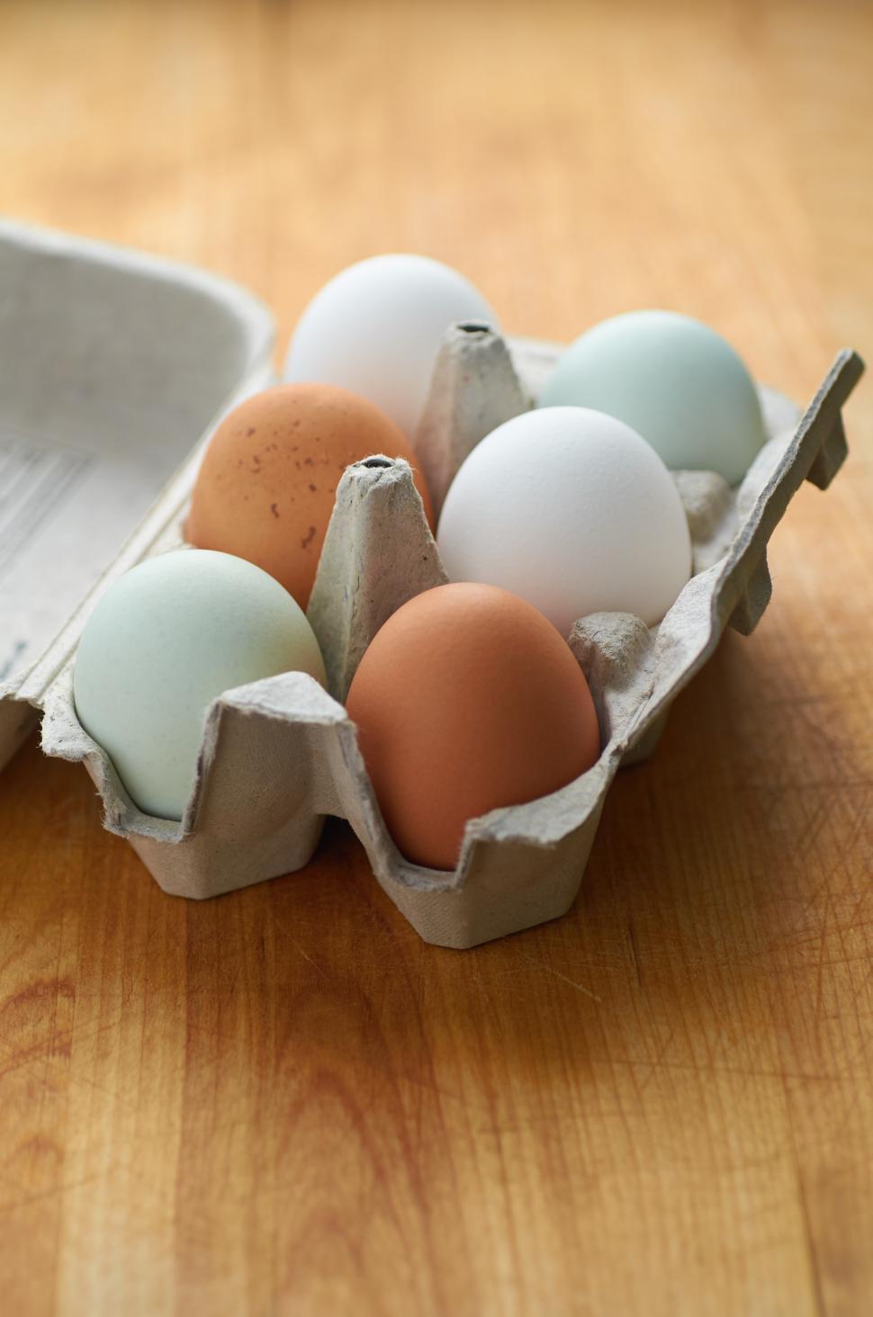 Free Image of A carton of eggs on a table 