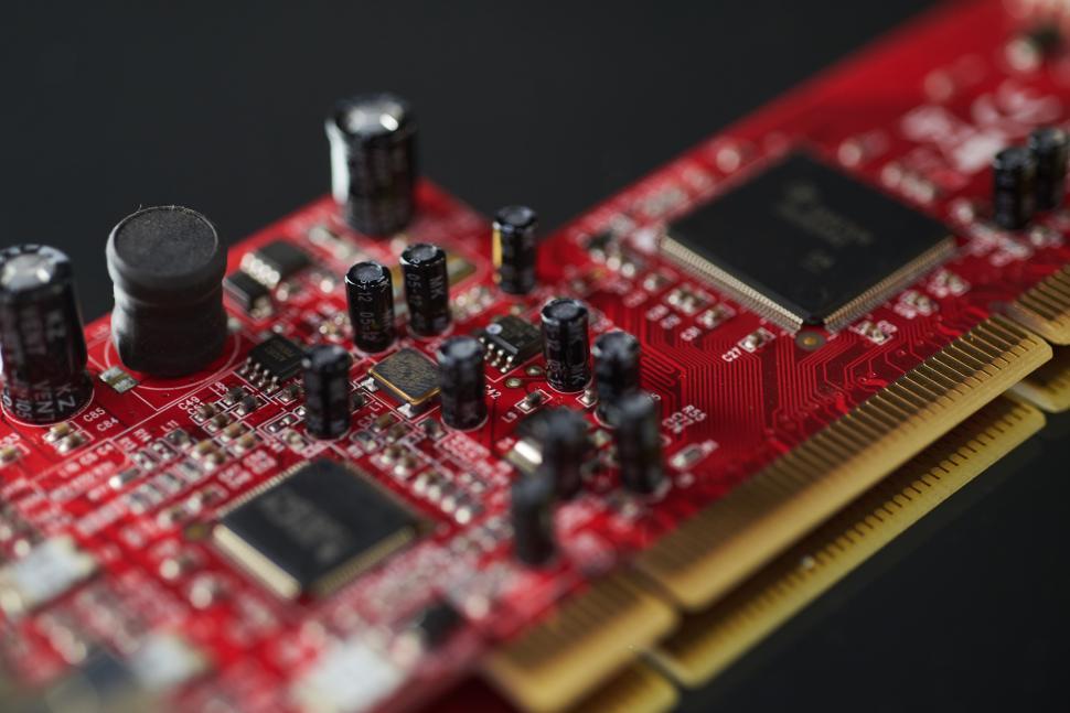 Free Image of A close up of a red circuit board 
