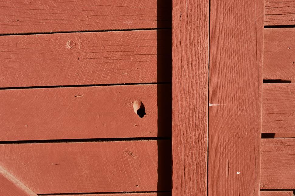 Free Image of A hole in a wood wall 