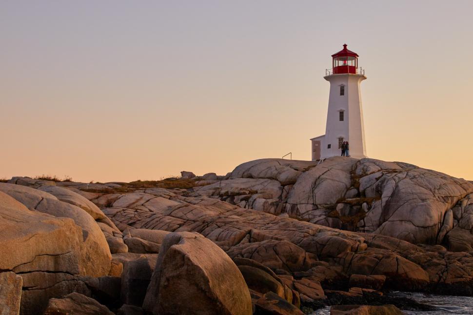 Free Image of A lighthouse on a rocky shore 