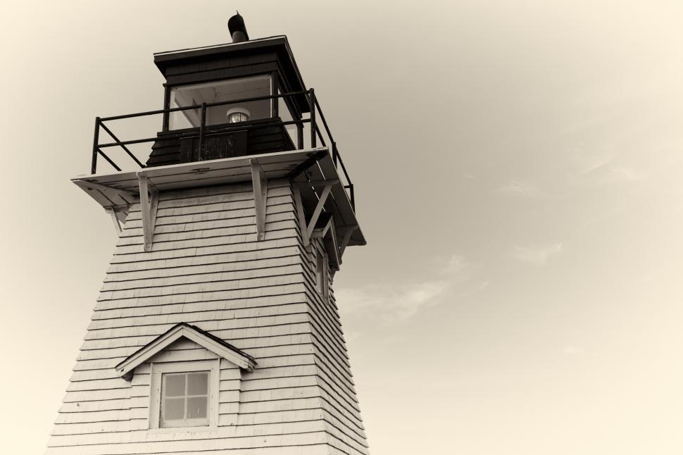 Free Image of A lighthouse with a bell on top 