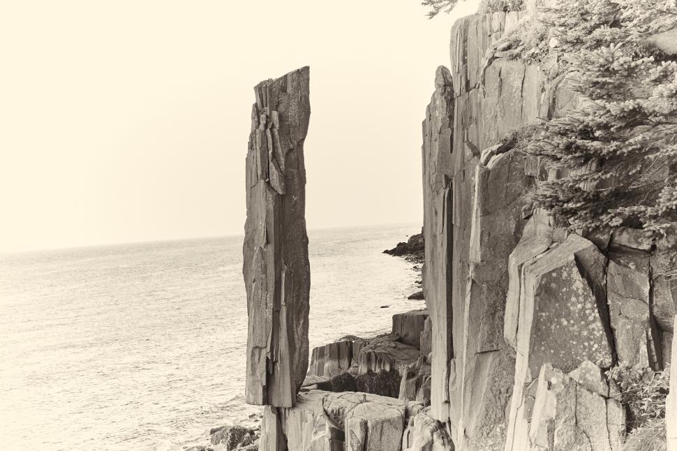 Free Image of A tall rock formations on a cliff 