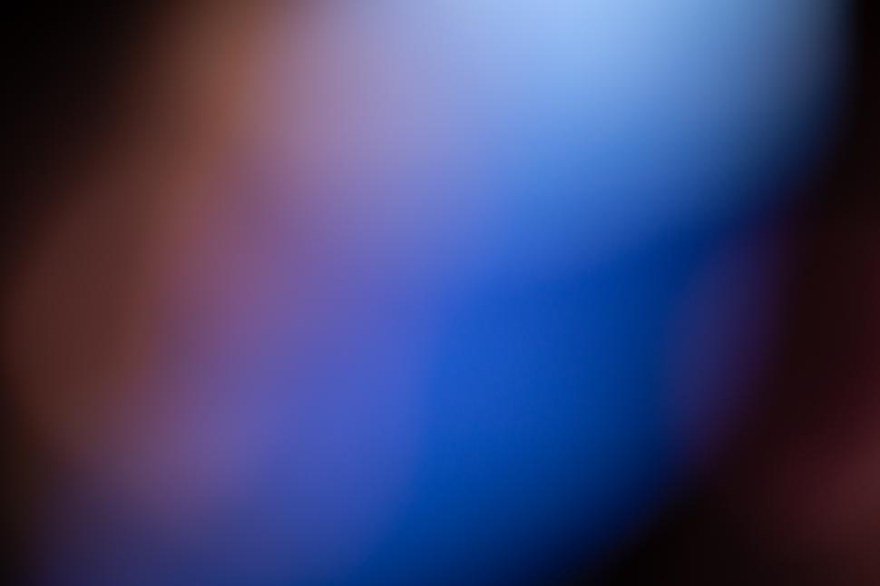 Free Image of A blurry blue and black background 