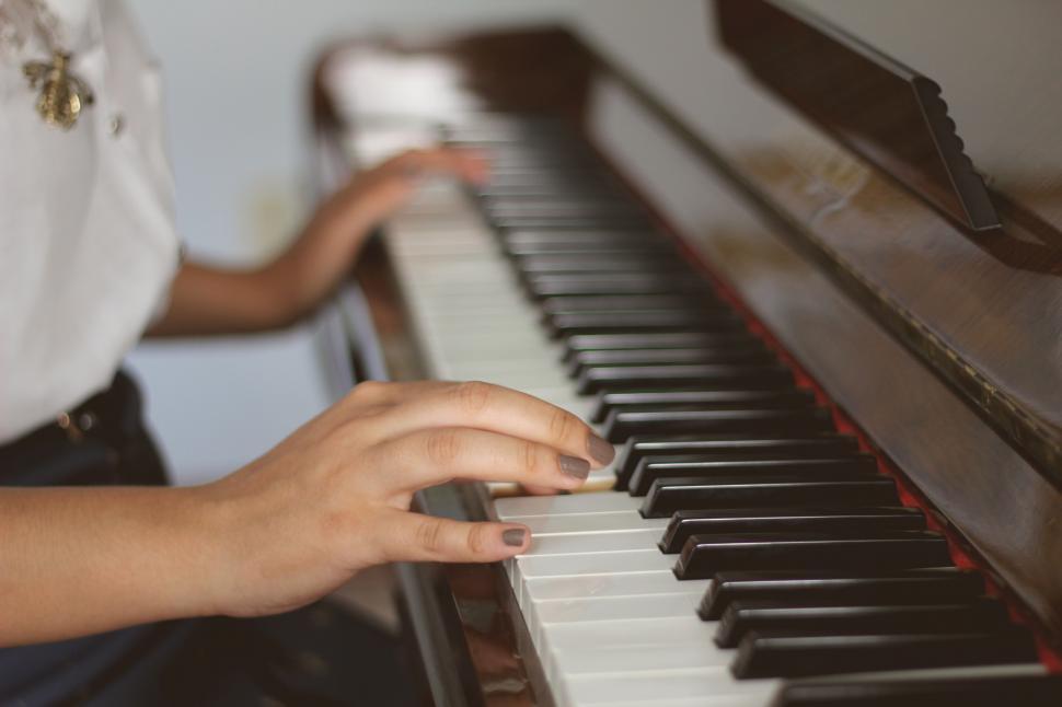 Free Image of A person playing a piano 