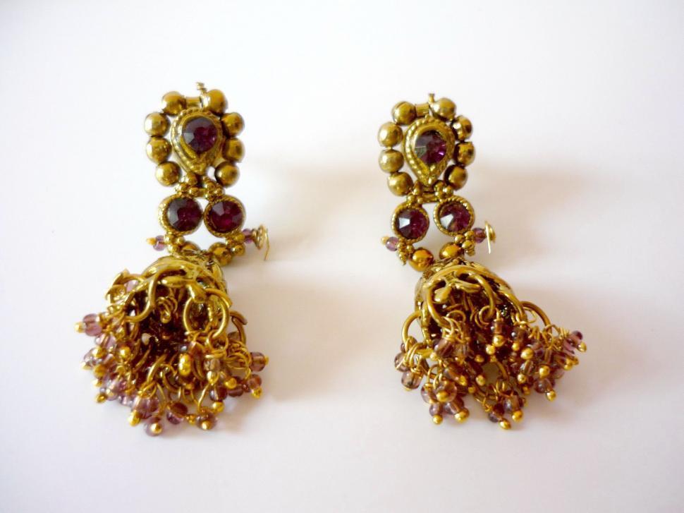 Free Image of Gold Tone Earrings With Brown Beads 