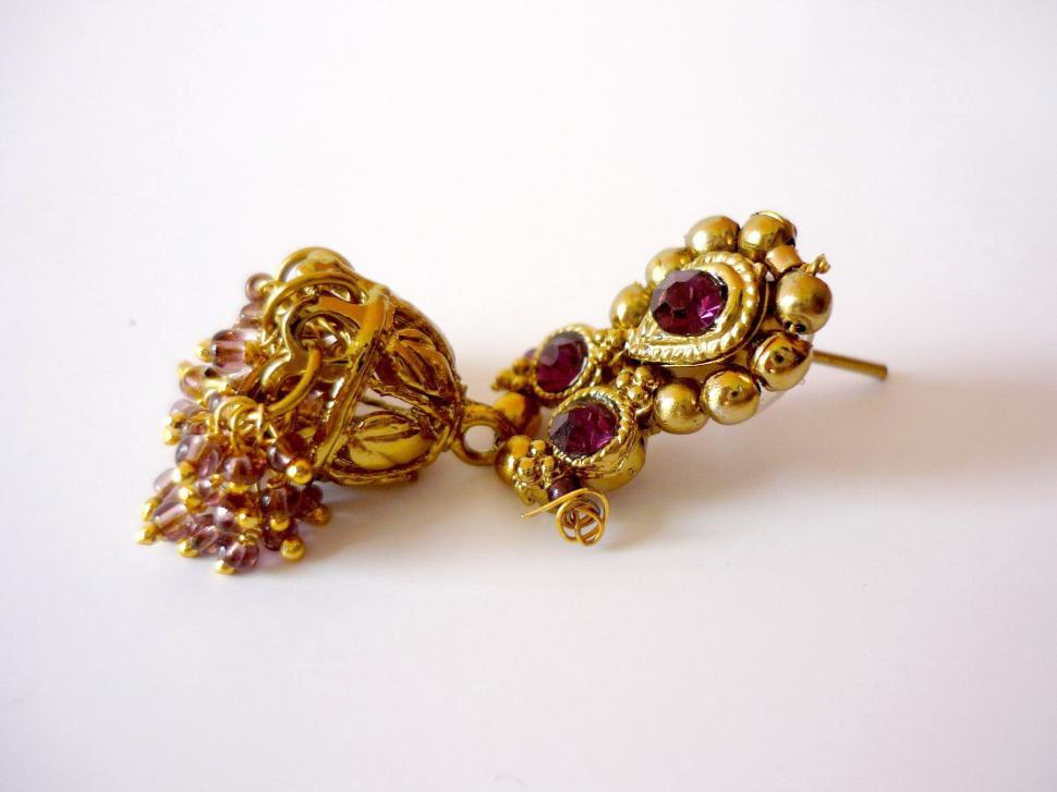 Free Image of Gold Toned Earrings With Garnets 