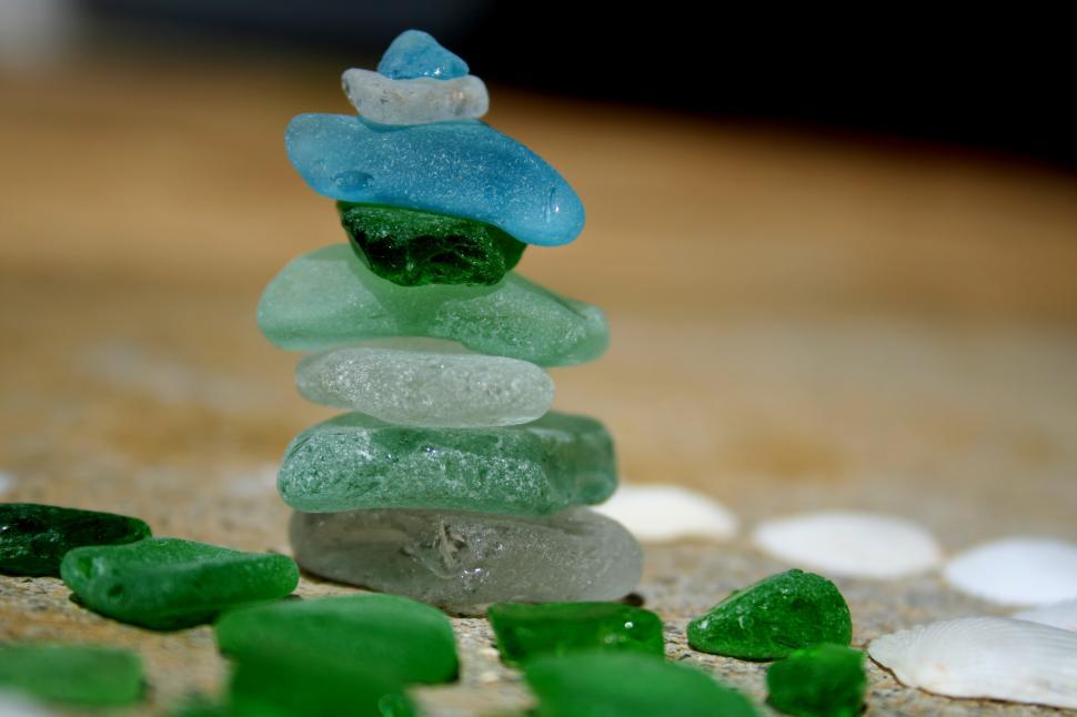 Free Image of A stack of sea glass on a surface 