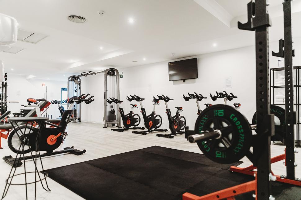 Free Image of A room with exercise bikes and a television 