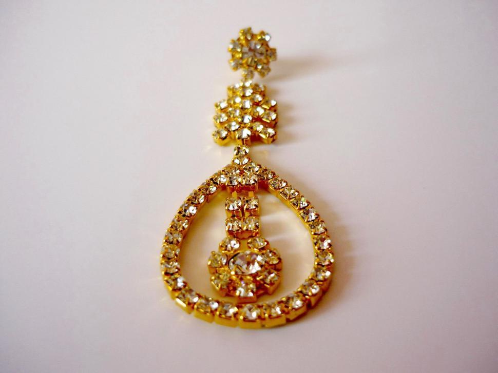 Free Image of Gold Pendant With Tear Shaped Drop 