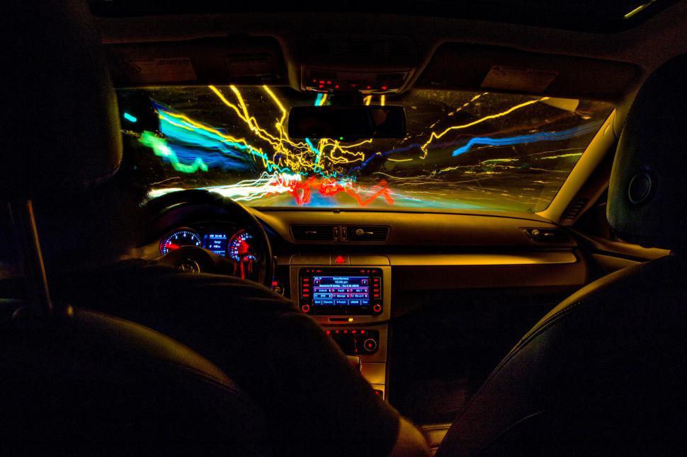Free Image of Inside a car with a view of the road through it 