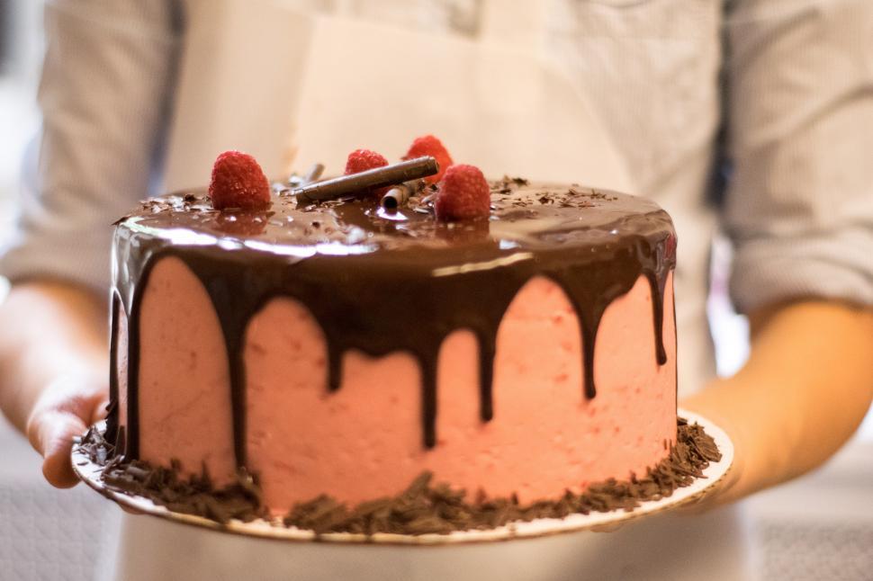Free Image of A cake with chocolate drizzled on top 
