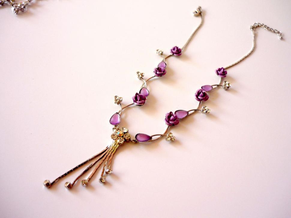 Free Image of Purple Beaded Necklace With Tassel 