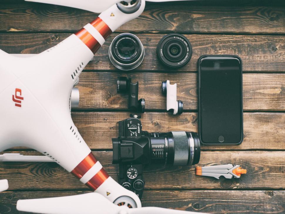 Free Image of A drone and camera and other equipment on a table 