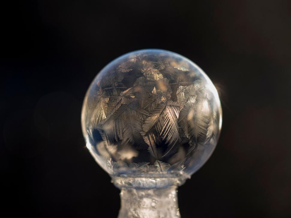 Free Image of A frosty glass ball with ice on top 