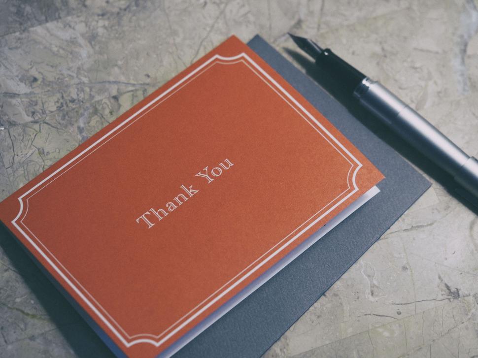 Free Image of A thank you card and pen 