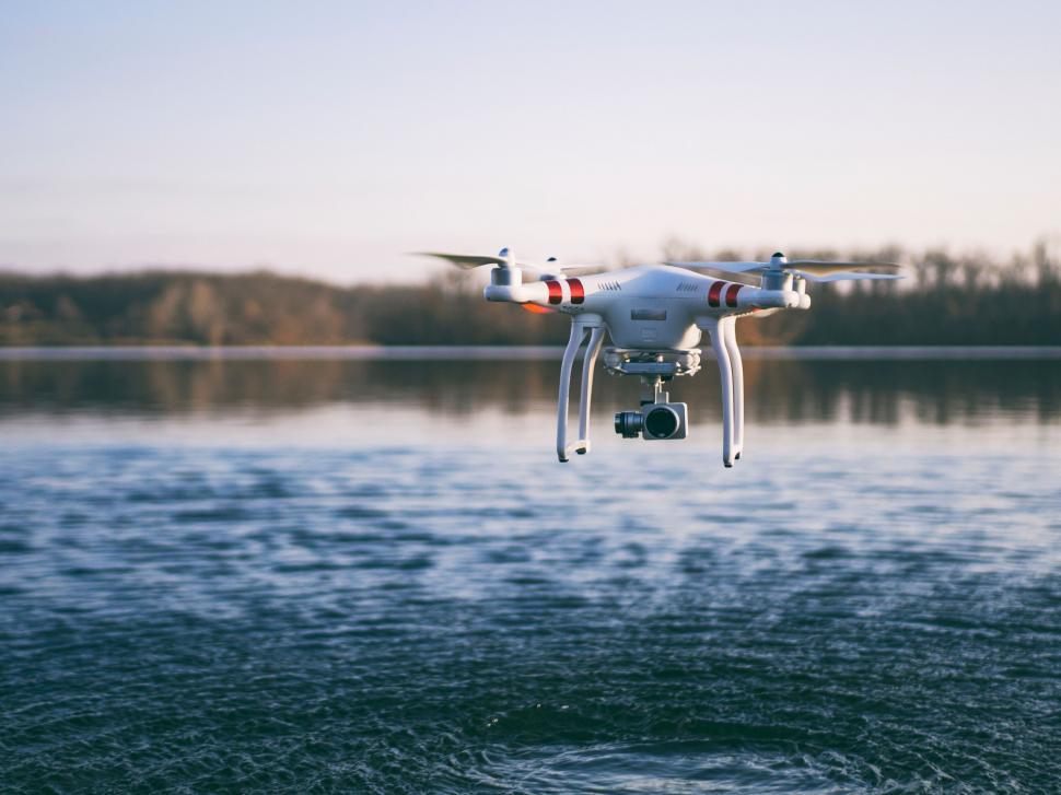 Free Image of A drone flying over water 