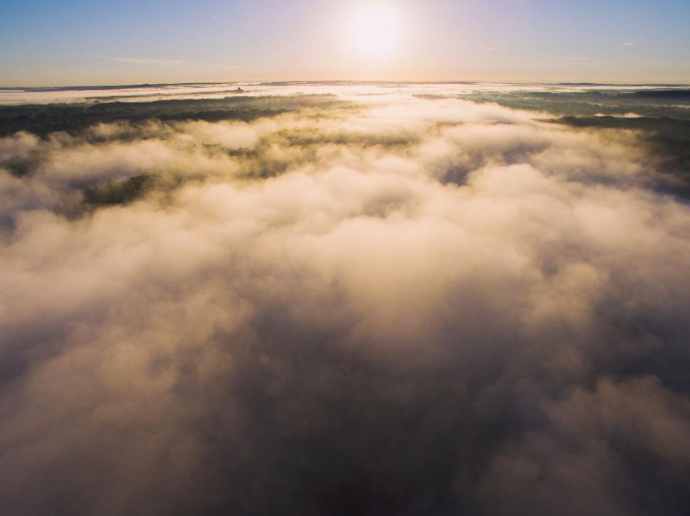 Free Image of A aerial view of clouds and trees 