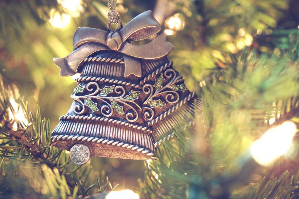 Free Image of A bell ornament from a tree 