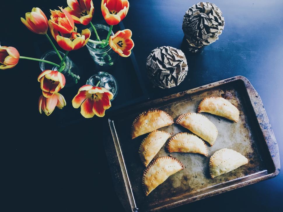 Free Image of A tray of pastries and flowers 