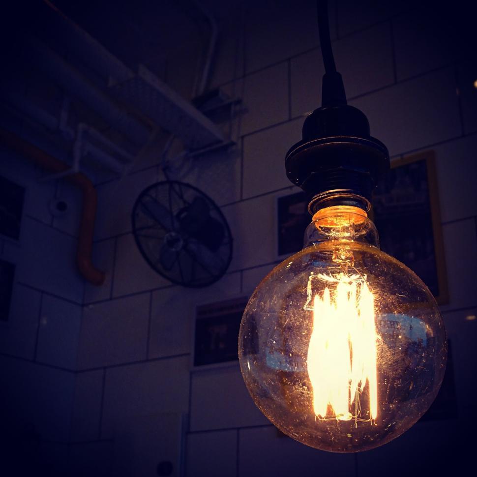 Free Image of A light bulb from a ceiling 