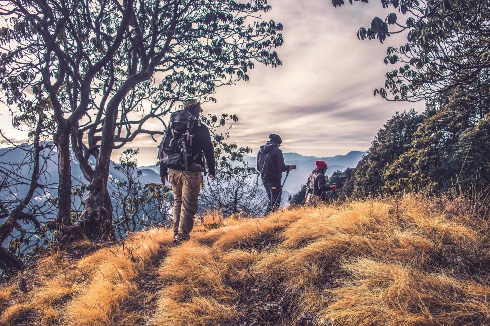 Free Image of A group of people hiking on a hill 
