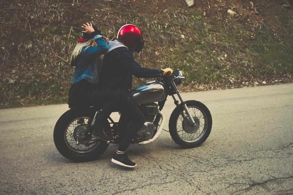 Free Image of A man and woman on a motorcycle 