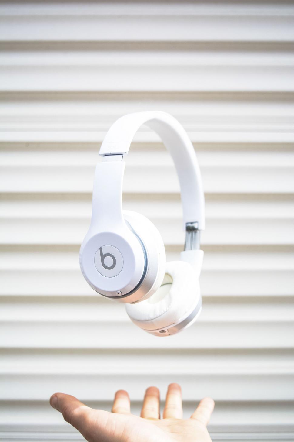 Free Image of A white headphones on a white background 
