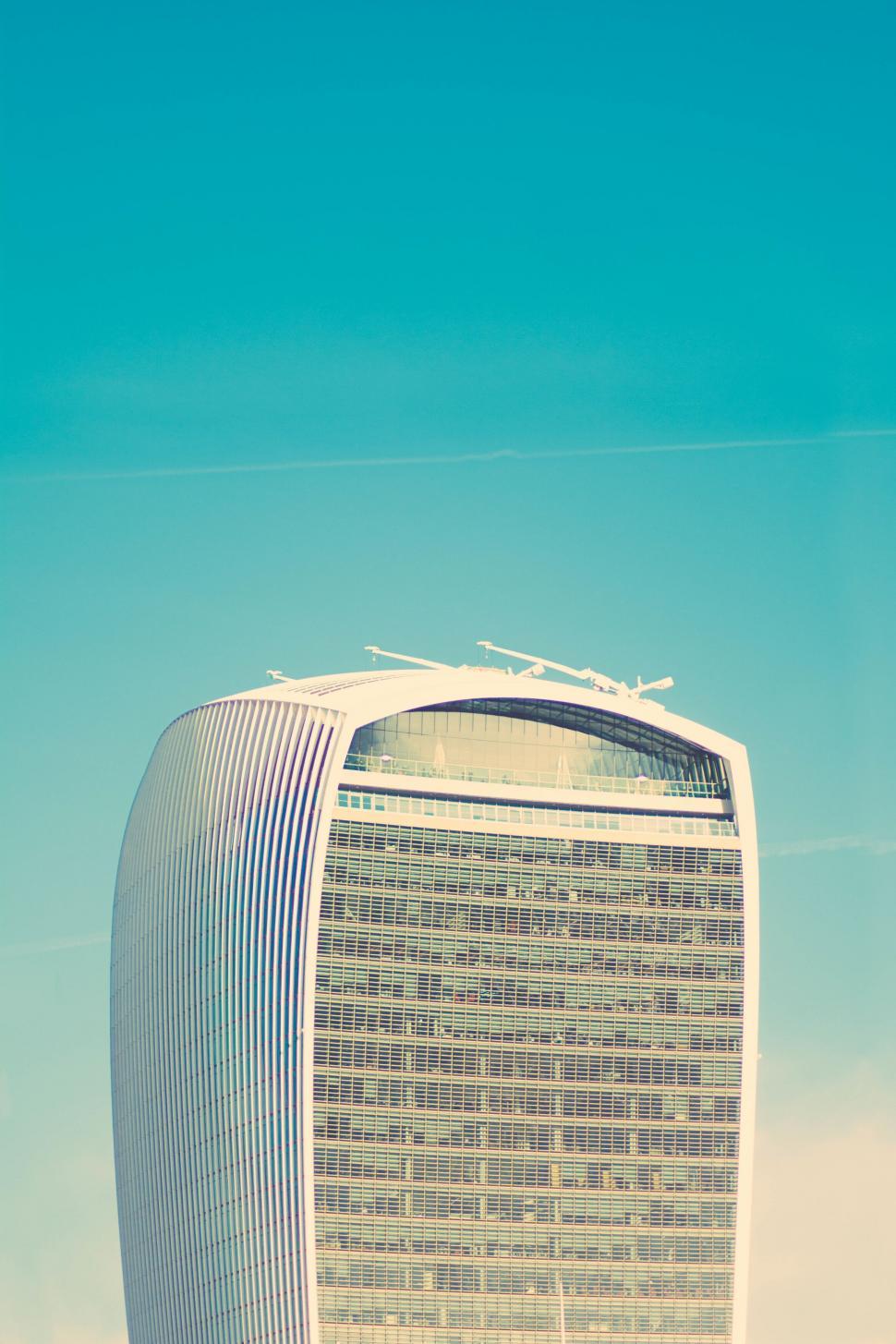 Free Image of A tall building with a curved roof 