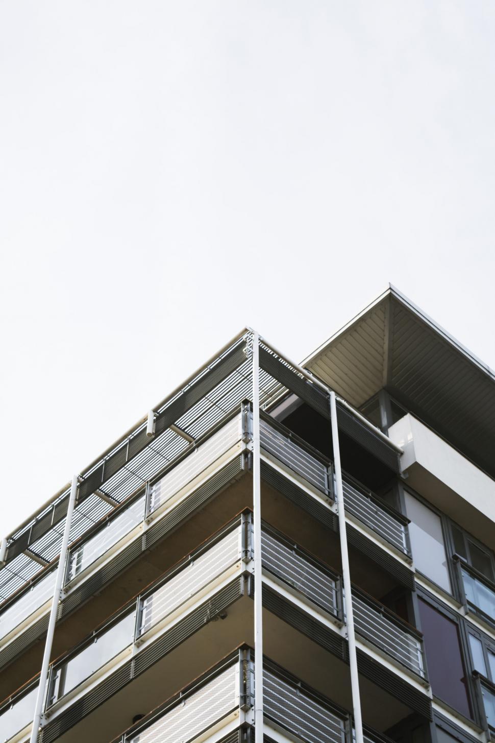 Free Image of A building with balconies and a roof 