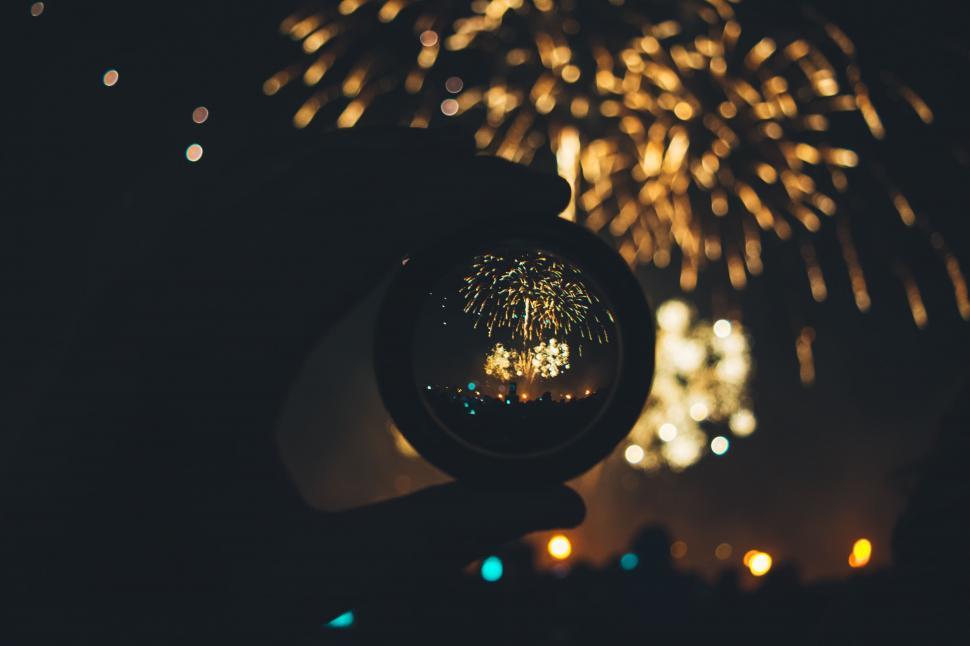Free Image of A lens with fireworks in the background 
