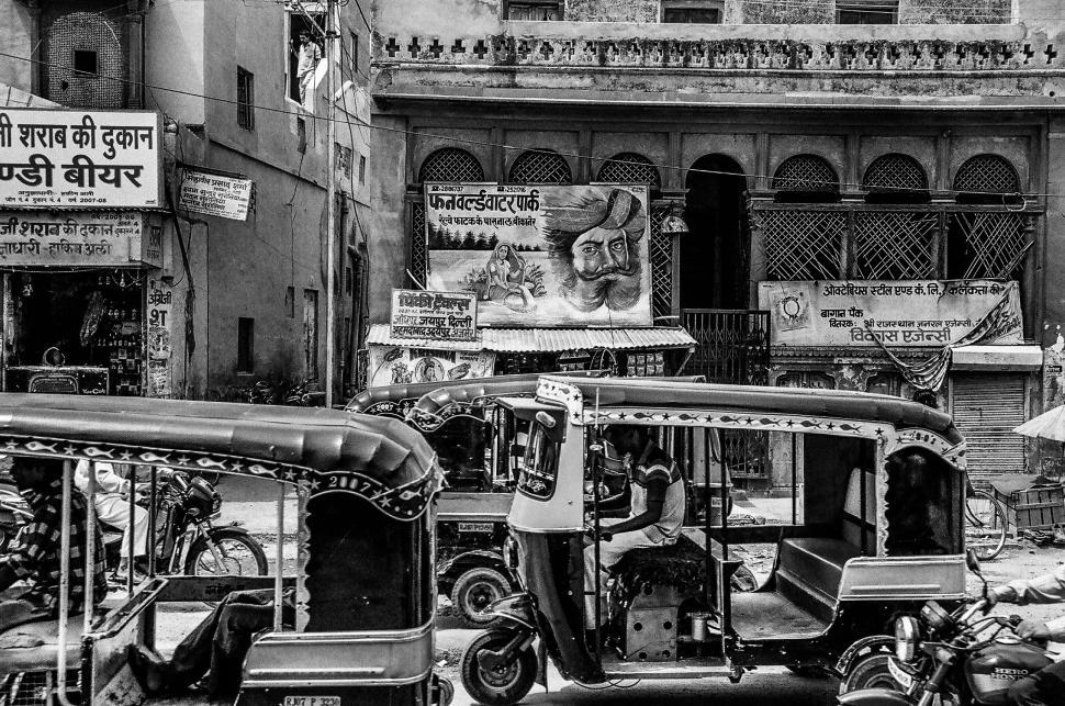Free Image of A group of rickshaws on a street 