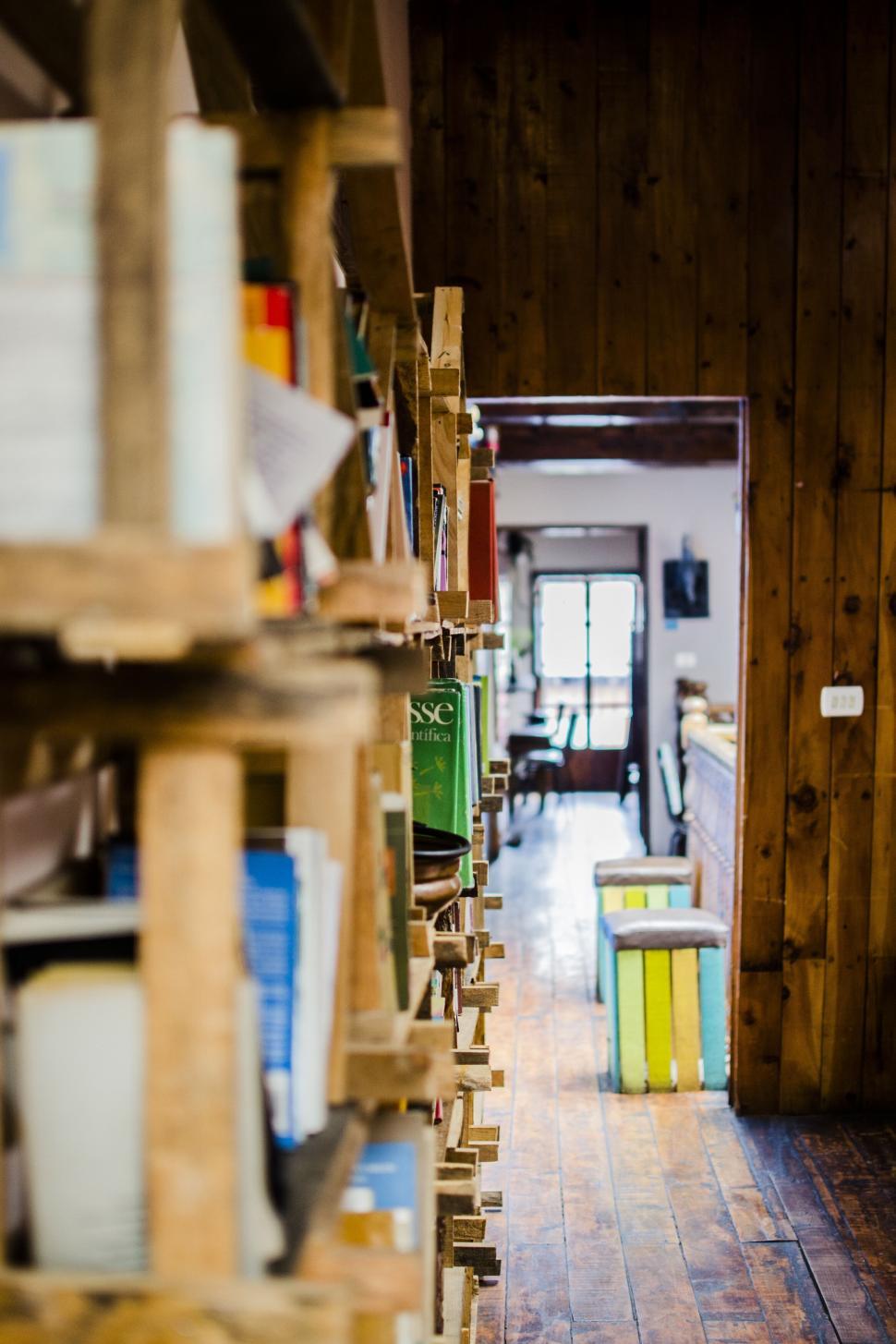 Free Image of A wooden shelves with books on them 