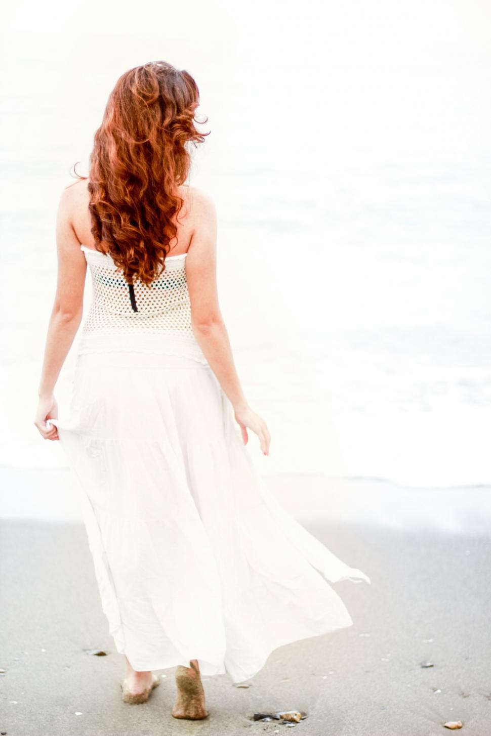 Free Image of A woman in a white dress 