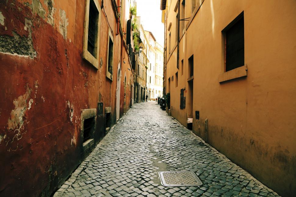Free Image of A stone alleyway between buildings 