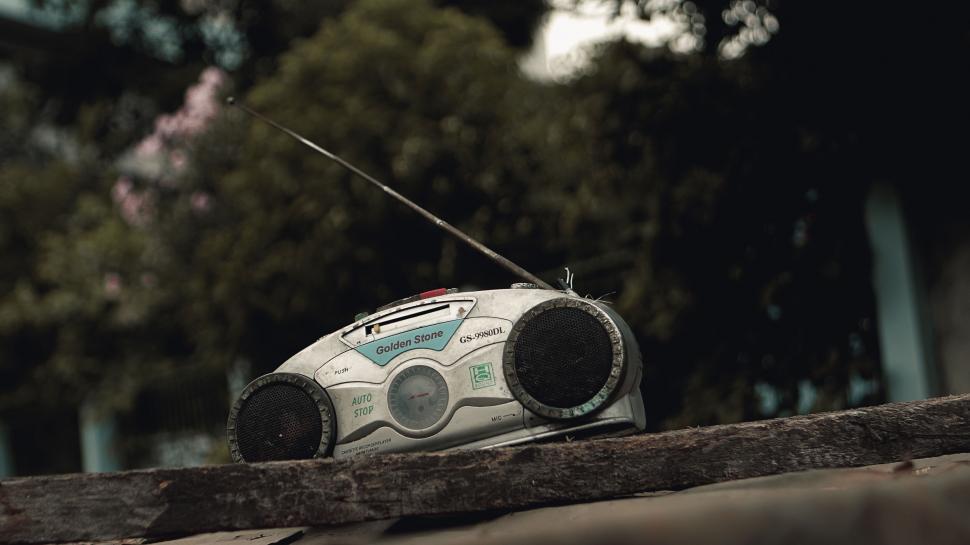 Free Image of A radio on a wood surface 
