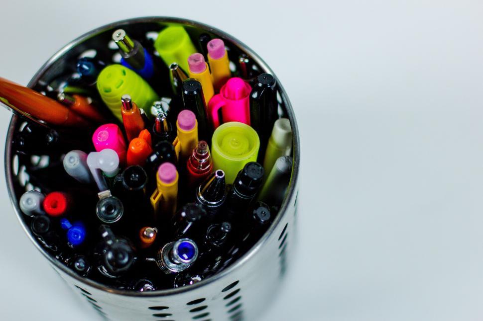 Free Image of A container full of pens and pens 