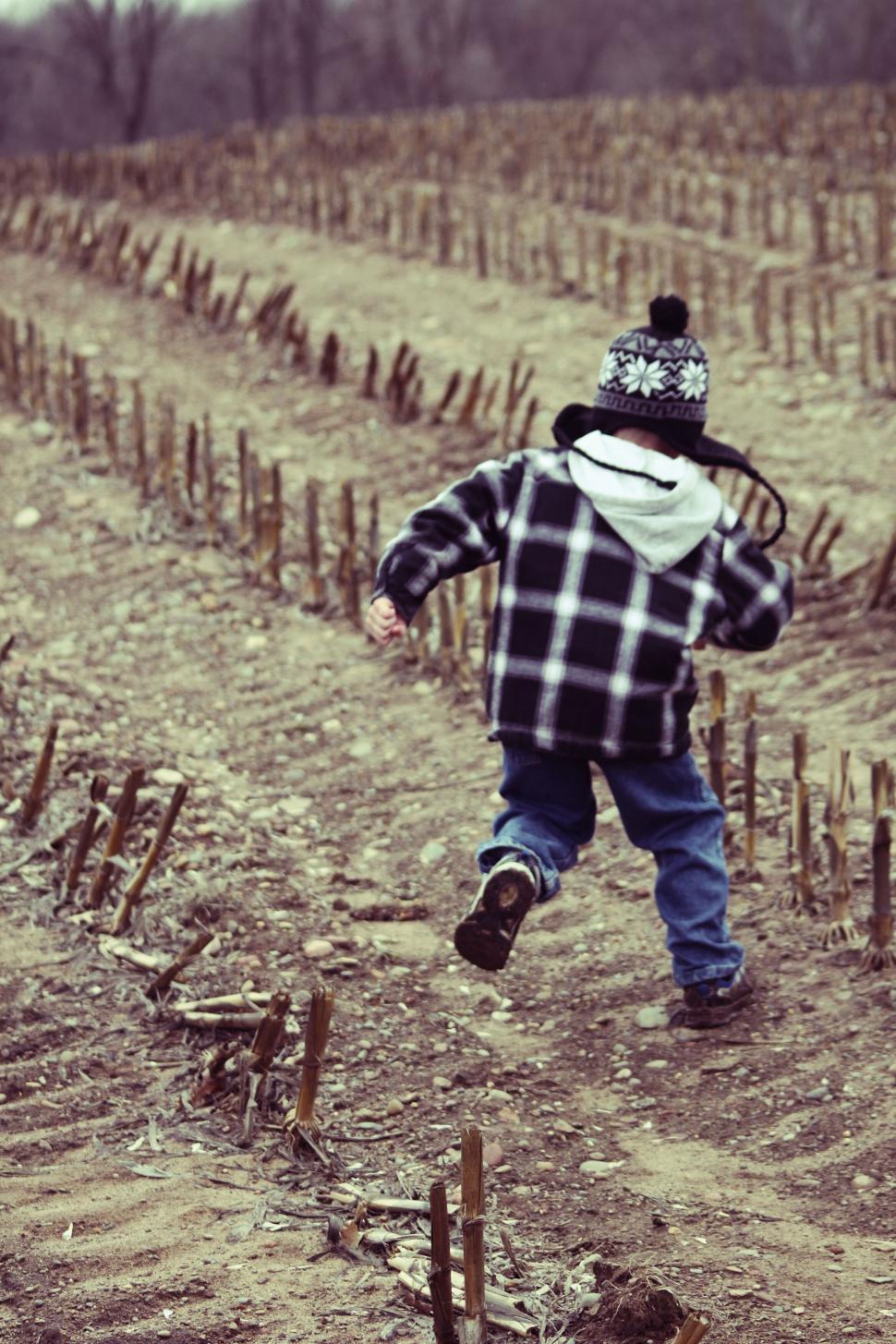 Free Image of A child running on a field 