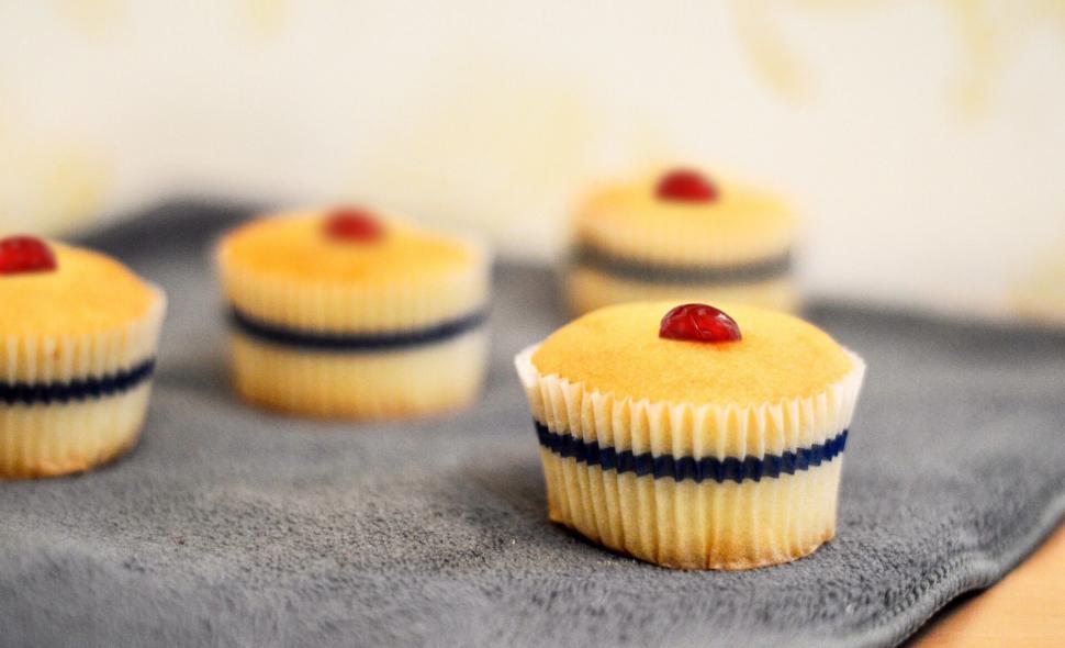 Free Image of A cupcakes with a cherry on top 