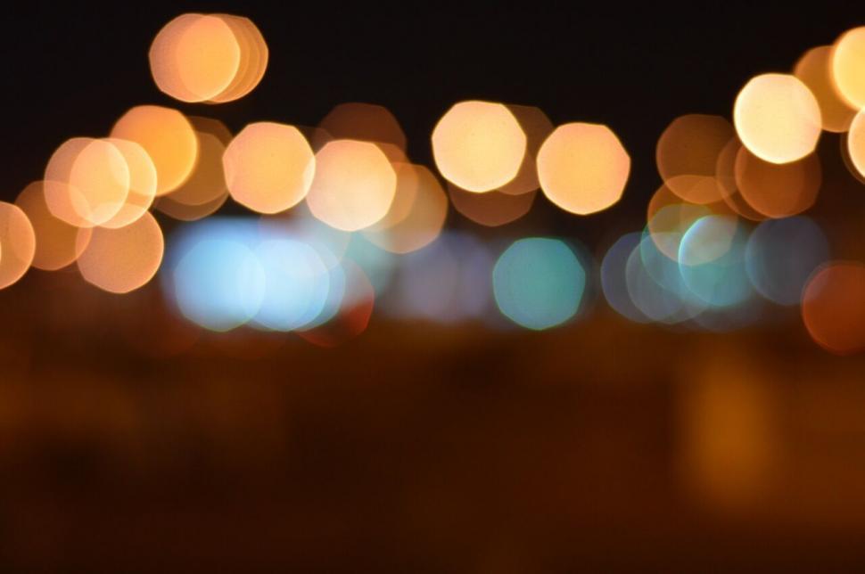 Free Image of A blurry image of lights at night 