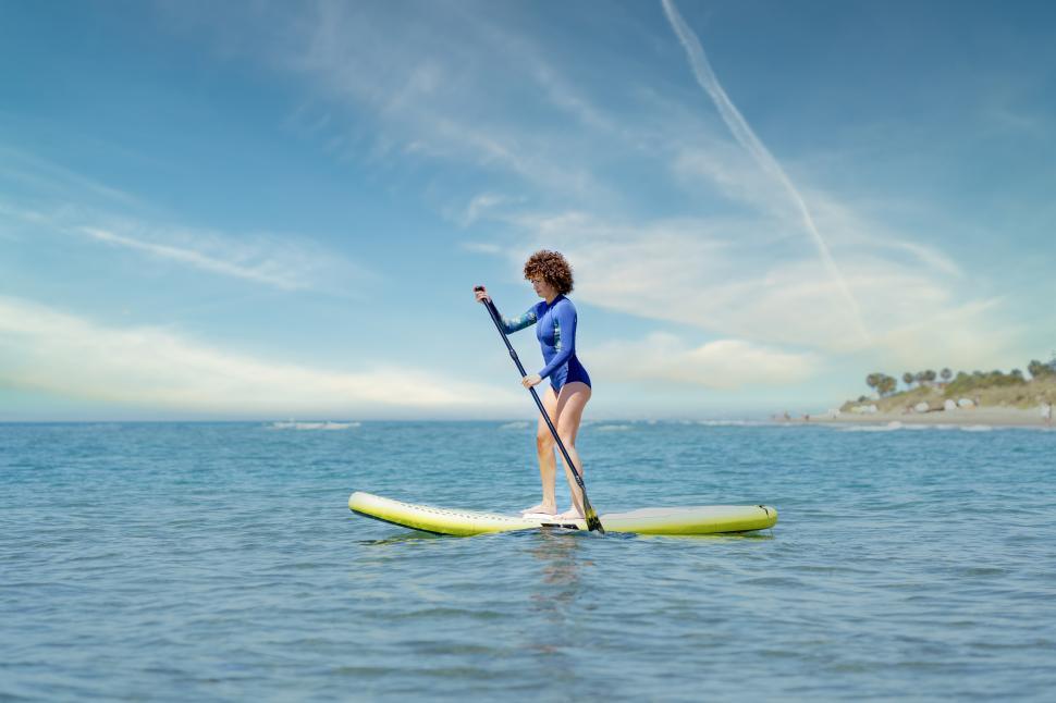 Free Image of Woman on paddleboard in sea 
