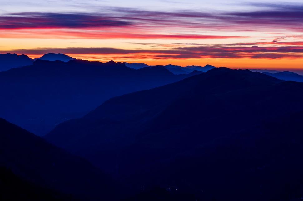Free Image of A sunset over mountains 