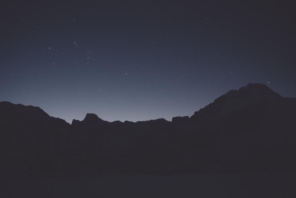 Free Image of A mountain range at night 
