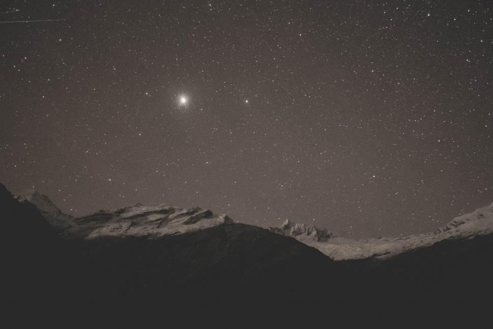 Free Image of A mountain range with stars in the sky 
