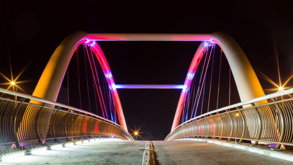 Free Image of A bridge with red and blue lights 