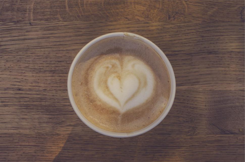 Free Image of A cup of coffee with a heart in the foam 