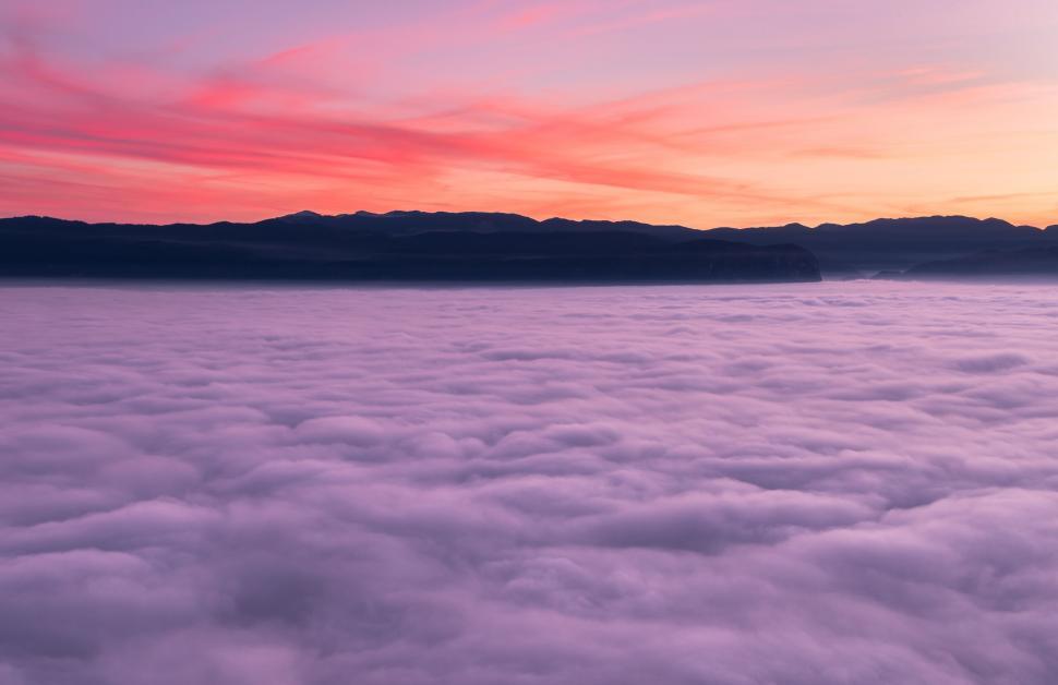 Free Image of Clouds and mountains in the distance 